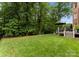Lush backyard with a spacious lawn and a deck area, perfect for outdoor relaxation at 7005 Camrose Crossing Ln, Matthews, NC 28104