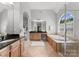 Luxurious bathroom with dual vanities, a soaking tub, and a glass-enclosed shower at 7005 Camrose Crossing Ln, Matthews, NC 28104