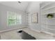 Bright bedroom with built-in bookshelves and a large window at 7005 Camrose Crossing Ln, Matthews, NC 28104