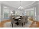 Elegant dining room with a modern chandelier and ample seating for dinner parties at 7005 Camrose Crossing Ln, Matthews, NC 28104