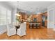Open kitchen with dining nook with great flow and features hardwood floors and stainless appliances at 7005 Camrose Crossing Ln, Matthews, NC 28104