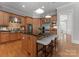A spacious kitchen features a center island with barstool seating and stainless steel appliances at 7005 Camrose Crossing Ln, Matthews, NC 28104
