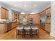 Gourmet kitchen features custom cabinets, granite countertops, a central island, and stainless appliances at 7005 Camrose Crossing Ln, Matthews, NC 28104