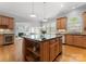 Open kitchen features a kitchen island, granite countertops, stainless steel appliances and an open floorplan at 7005 Camrose Crossing Ln, Matthews, NC 28104