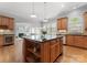 Spacious kitchen with granite counters, stainless steel appliances and a wine fridge at 7005 Camrose Crossing Ln, Matthews, NC 28104