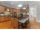 Open concept kitchen with granite countertops, stainless appliances, and seating at the central island at 7005 Camrose Crossing Ln, Matthews, NC 28104