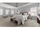Bright main bedroom with ample natural light, neutral tones, and a seating area at 7005 Camrose Crossing Ln, Matthews, NC 28104