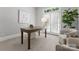 Home office with a large desk, natural light, and comfortable seating at 7005 Camrose Crossing Ln, Matthews, NC 28104
