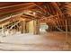 Expansive unfinished room featuring exposed beams offers great potential for creating additional living space at 7005 Camrose Crossing Ln, Matthews, NC 28104