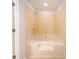 Bathroom featuring a tub and tile surround at 7116 Winery Ln, Charlotte, NC 28227