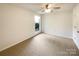 Cozy bedroom with ceiling fan, neutral carpet, and lots of natural light at 7116 Winery Ln, Charlotte, NC 28227