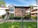 Exterior view of a townhouse with landscaped yard, steps, and wooden accents at 7116 Winery Ln, Charlotte, NC 28227