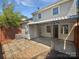 Backyard featuring a covered patio with a brick area, leading to the main house at 8026 Regent Park Ln, Charlotte, NC 28210