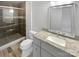 Bathroom with tiled shower, granite countertop vanity and updated fixtures at 8026 Regent Park Ln, Charlotte, NC 28210