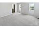 Spacious bedroom featuring plush carpeting and large windows offering plenty of natural light at 8026 Regent Park Ln, Charlotte, NC 28210