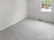 Bedroom with neutral carpet and a bright window view at 8026 Regent Park Ln, Charlotte, NC 28210