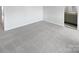 Large bedroom featuring new carpeting and easy access to the ensuite bathroom at 8026 Regent Park Ln, Charlotte, NC 28210