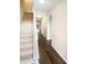 Bright hallway with hardwood floors, staircase, and plenty of natural light at 8026 Regent Park Ln, Charlotte, NC 28210