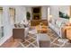 Staged living room featuring a stone fireplace and cozy furnishings at 8026 Regent Park Ln, Charlotte, NC 28210