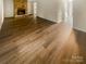 Spacious living room with stone fireplace and wood-look flooring at 8026 Regent Park Ln, Charlotte, NC 28210