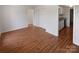 Inviting living room featuring laminate floors and ample space for gatherings at 8026 Regent Park Ln, Charlotte, NC 28210