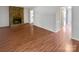 Spacious living room with laminate floors and a stone fireplace, perfect for cozy evenings at 8026 Regent Park Ln, Charlotte, NC 28210