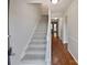 Carpeted staircase leading to the upper level with views of the hallway at 8026 Regent Park Ln, Charlotte, NC 28210