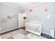 Charming Bedroom with a whimsical hand painted design, complemented by elegant light fixtures at 8428 Westmoreland Lake Dr, Cornelius, NC 28031
