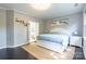 Cozy main bedroom with neutral tones, an ensuite bathroom, and ample natural light at 8428 Westmoreland Lake Dr, Cornelius, NC 28031