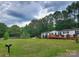 Charming single story home with a well-maintained lawn and a spacious wooden wheelchair ramp at 8813 Summerhill Dr, Waxhaw, NC 28173