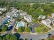 Aerial view of a neighborhood featuring a community pool, landscaping, and sidewalks at 9904 Rocky Ford Club Rd, Charlotte, NC 28269