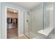 Bathroom featuring a glass shower and a walk-in closet at 9904 Rocky Ford Club Rd, Charlotte, NC 28269