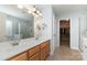 Bathroom with a double sink, vanity, and walk-in closet at 9904 Rocky Ford Club Rd, Charlotte, NC 28269