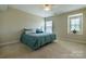 Neutral bedroom featuring a double bed, soft carpet, and a ceiling fan for added comfort at 9904 Rocky Ford Club Rd, Charlotte, NC 28269