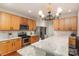 Modern kitchen featuring stainless steel appliances, custom cabinets, subway tile backsplash, and granite countertops at 9904 Rocky Ford Club Rd, Charlotte, NC 28269