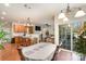 Open-concept kitchen flows into the dining area with light wood cabinets and hardwood floors at 9904 Rocky Ford Club Rd, Charlotte, NC 28269