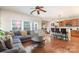 Open concept with a living room featuring a sectional, a bar and a kitchen at 9904 Rocky Ford Club Rd, Charlotte, NC 28269