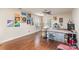 Spacious room featuring natural lighting, hardwood floors, and an art creation station at 9904 Rocky Ford Club Rd, Charlotte, NC 28269