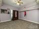 Bedroom featuring a ceiling fan, carpet flooring, an armoire and closet with shelving at 1009 Preston Dr, Lowell, NC 28098