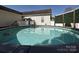 Outdoor above ground pool featuring clear blue water and a ladder at 1009 Preston Dr, Lowell, NC 28098