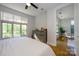 Comfortable bedroom filled with natural light, featuring hardwood floors at 1101 W 1St St # 405, Charlotte, NC 28202
