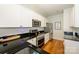 Contemporary kitchen showcasing sleek black countertops, stainless steel appliances, and white subway tile backsplash at 1101 W 1St St # 405, Charlotte, NC 28202