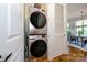 Efficient laundry area featuring a stacked washer and dryer unit, and storage at 1101 W 1St St # 405, Charlotte, NC 28202