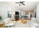 Bright living room featuring hardwood floors, an area rug, and natural light streaming through the windows at 1101 W 1St St # 405, Charlotte, NC 28202