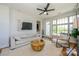 Inviting living room with hardwood floors, ceiling fan, neutral paint, and lots of natural light at 1101 W 1St St # 405, Charlotte, NC 28202