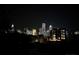 City skyline view at night, beautifully illuminated against the dark sky at 1101 W 1St St # 405, Charlotte, NC 28202