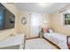Bright bedroom with hardwood floors, a cozy bed, and natural light from the window at 1114 Hartford Ave, Charlotte, NC 28209