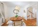 Dining room with hardwood floors, round table, and stylish lighting fixture, perfect for Gathering gatherings at 1114 Hartford Ave, Charlotte, NC 28209