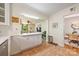 Charming kitchen with view into the living room and adjacent dining area at 1114 Hartford Ave, Charlotte, NC 28209