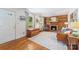 Spacious living room with hardwood floors, fireplace, wood accent wall and an abundance of natural light at 1114 Hartford Ave, Charlotte, NC 28209
